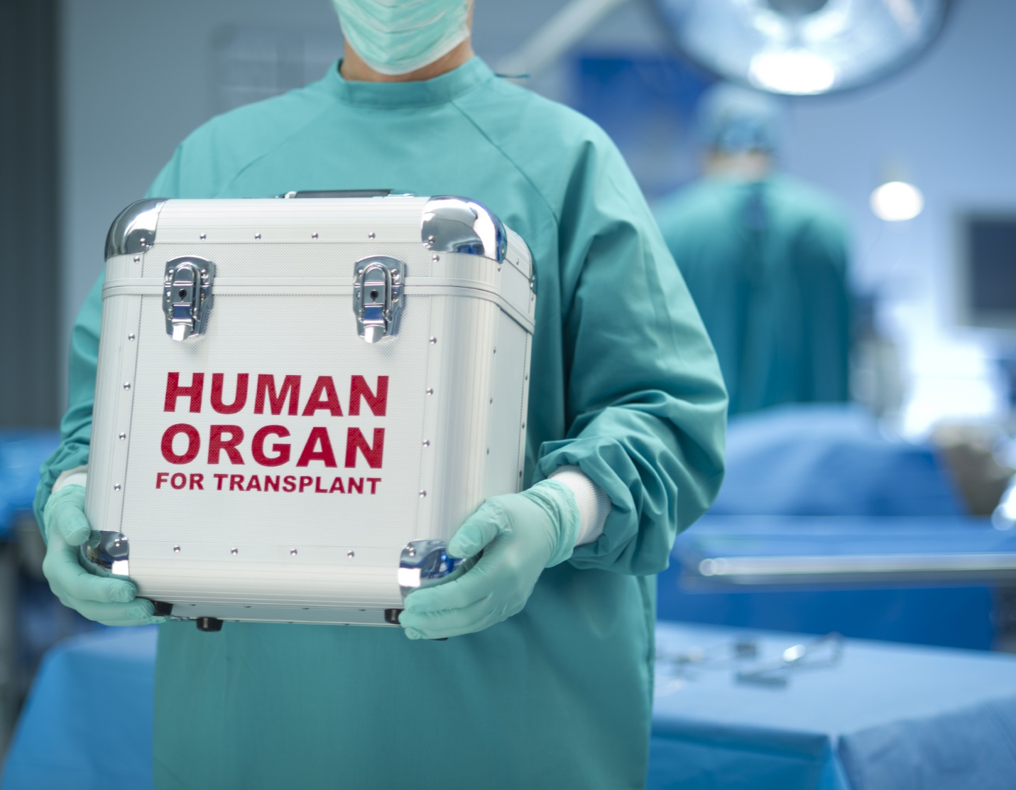 Doctor holding briefcase with the title human organ for transplant